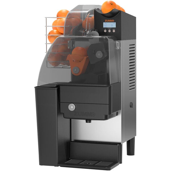 A Zummo Z1 Nature Compact Graphite commercial orange juicer with oranges in it.