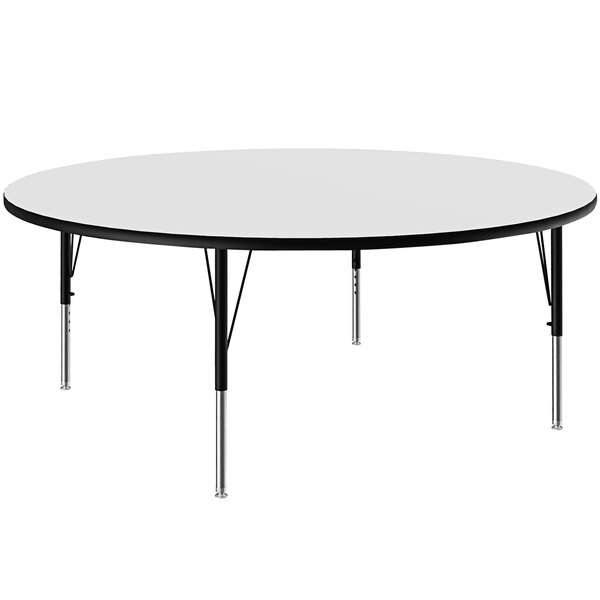 A white Correll round activity table with black legs.