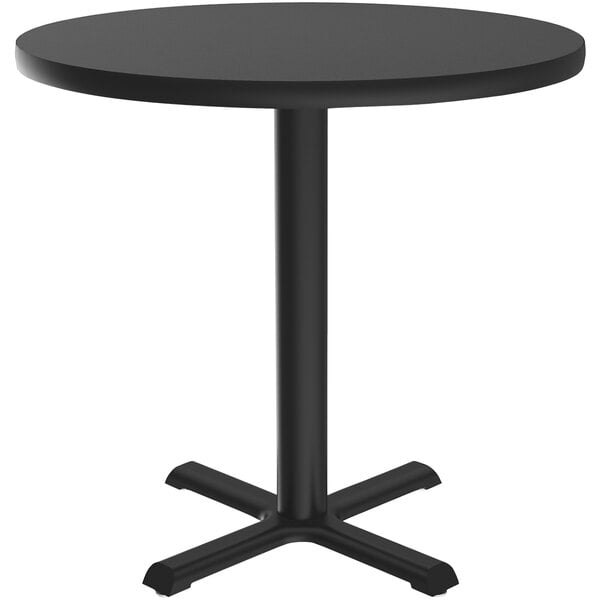 A Correll black granite round table with a black metal base.