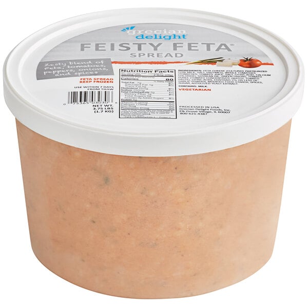 A white plastic container of Grecian Delight Feisty Feta Spread with a lid and label.