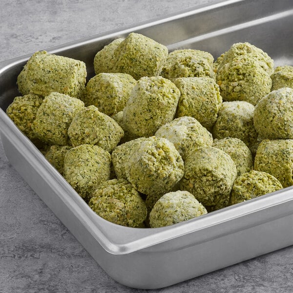 A metal tray filled with Grecian Delight Falafel Fritters.