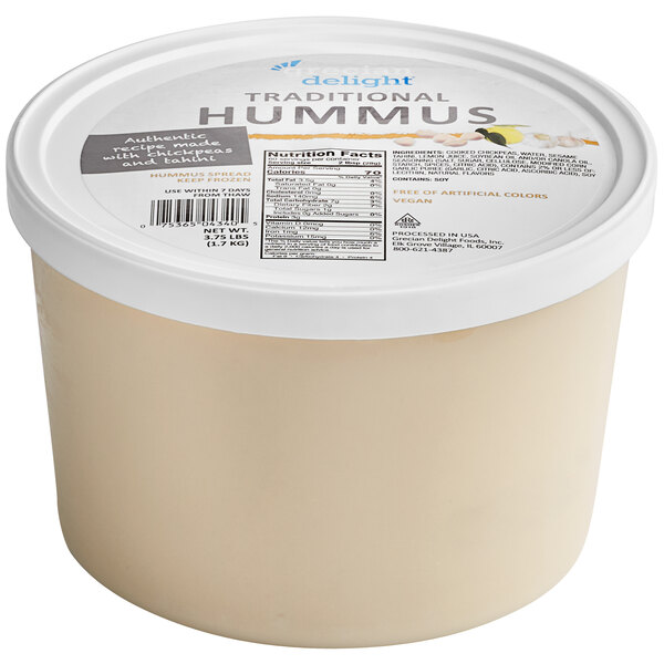 A white plastic container of Grecian Delight Traditional Hummus.