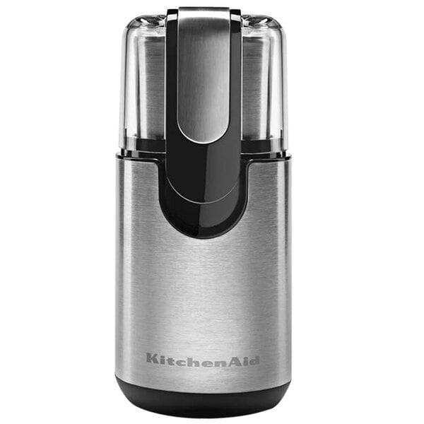 A close-up of a silver and black KitchenAid coffee grinder.