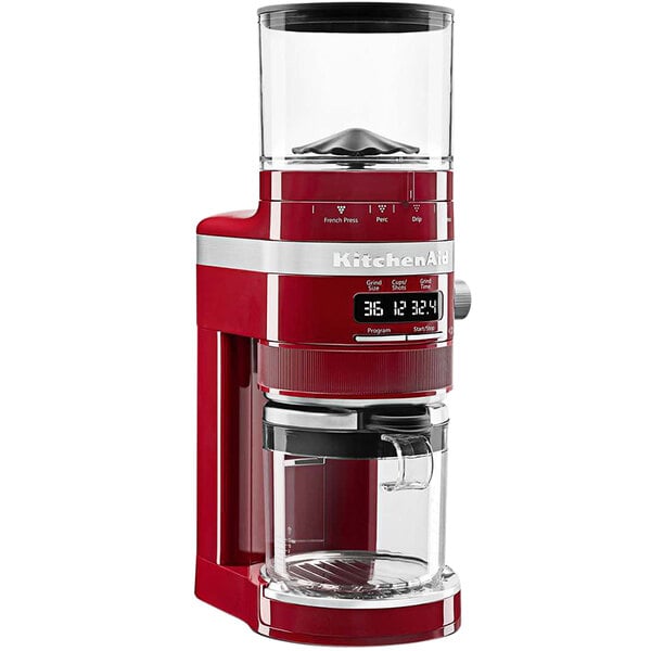 A red KitchenAid commercial coffee grinder with a glass jar.