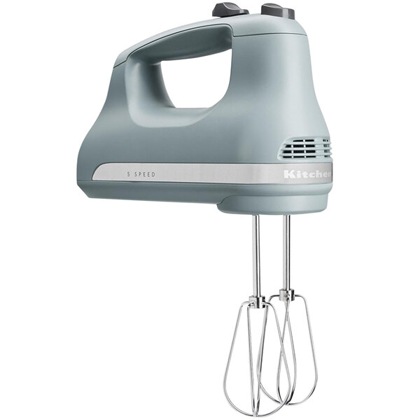 A KitchenAid fog blue hand mixer with white text.