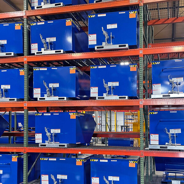 A large blue box with a metal chain on it on a shelf.