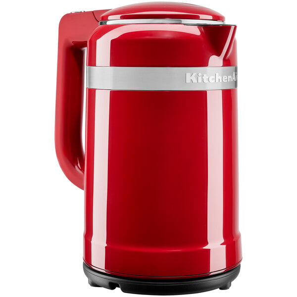 A red KitchenAid electric kettle with silver trim.