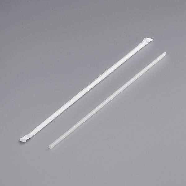 Two white plastic wrapped straws.