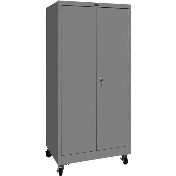 A grey metal Hallowell storage cabinet with wheels.