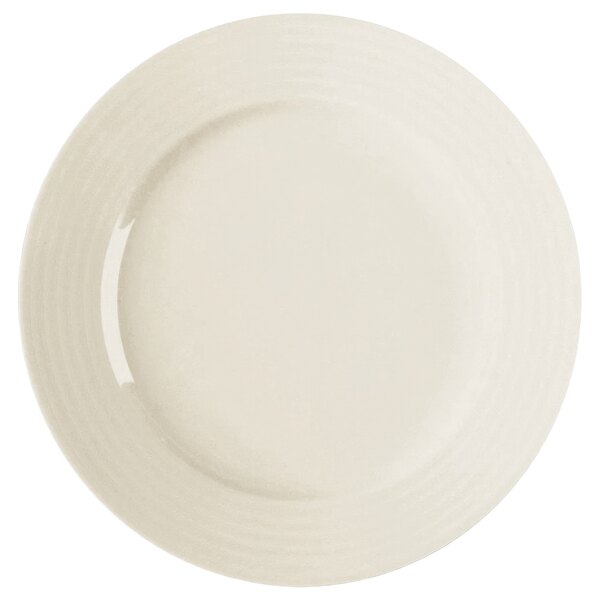 A white RAK Porcelain flat plate with a curved edge.