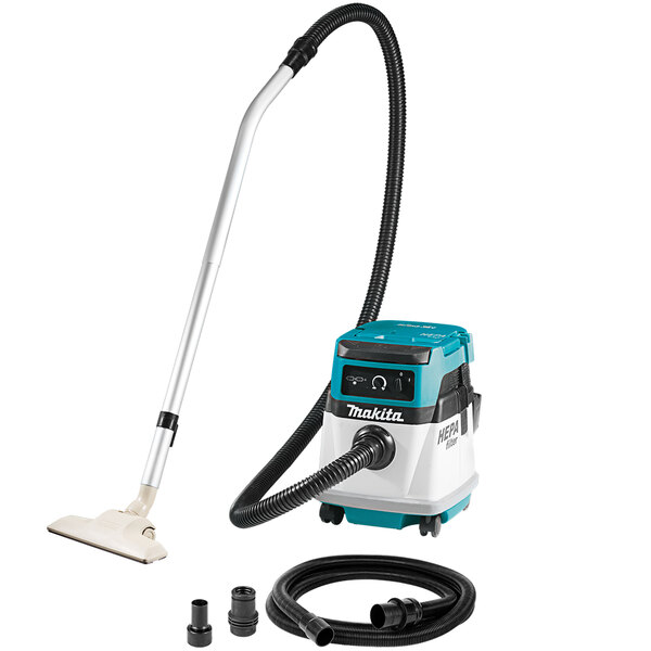 A Makita cordless/corded vacuum cleaner with a hose and tube.