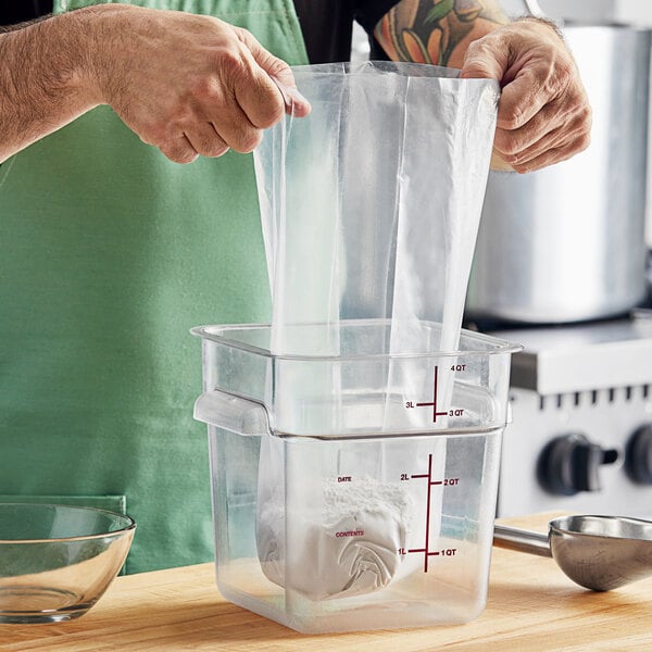 A person pouring flour from a Choice plastic bag into a container.