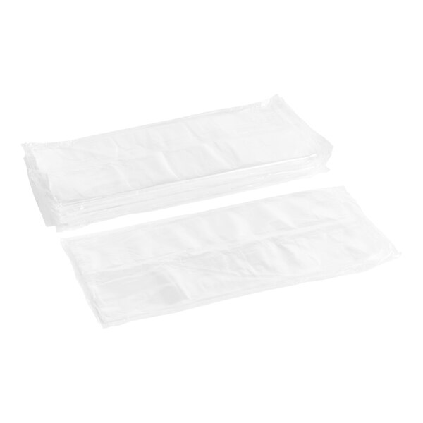Two white plastic bags on a white surface.