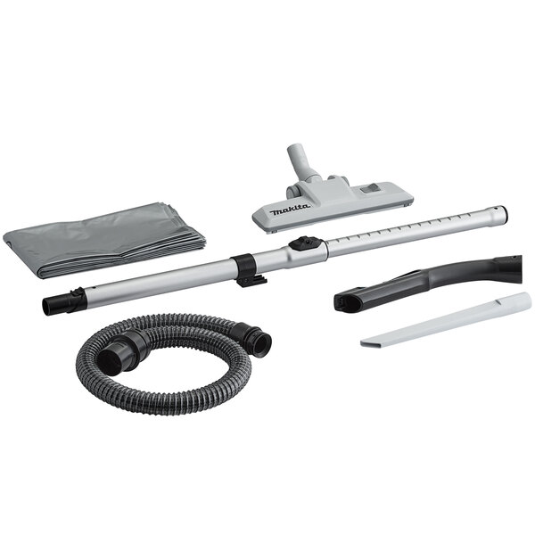 A Makita wet/dry vacuum with hose and accessories.