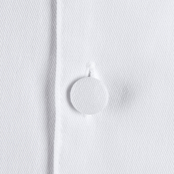 A close-up of a white Chef Revival executive chef coat button.