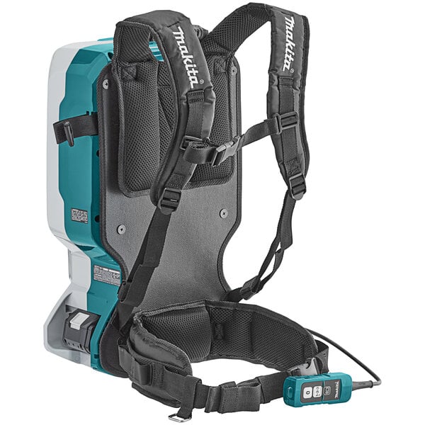 A black and grey Makita backpack vacuum with straps.