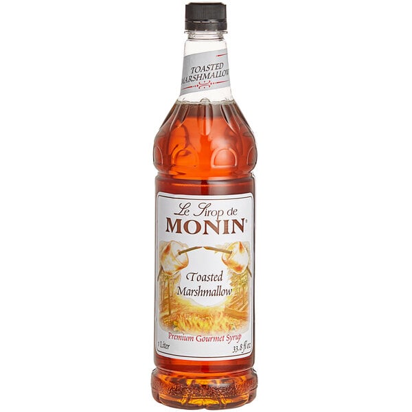 A close up of a Monin Toasted Marshmallow Flavoring Syrup bottle.
