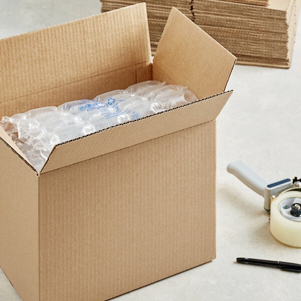 A Lavex corrugated shipping box with plastic bottles inside.