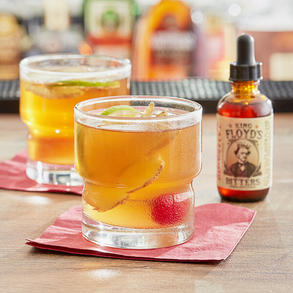 A couple of glasses of King Floyd's Ginger Digestive Bitters on a table.