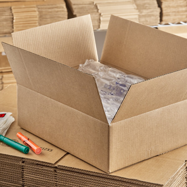 A Lavex kraft cardboard shipping box with bubble wrap inside.