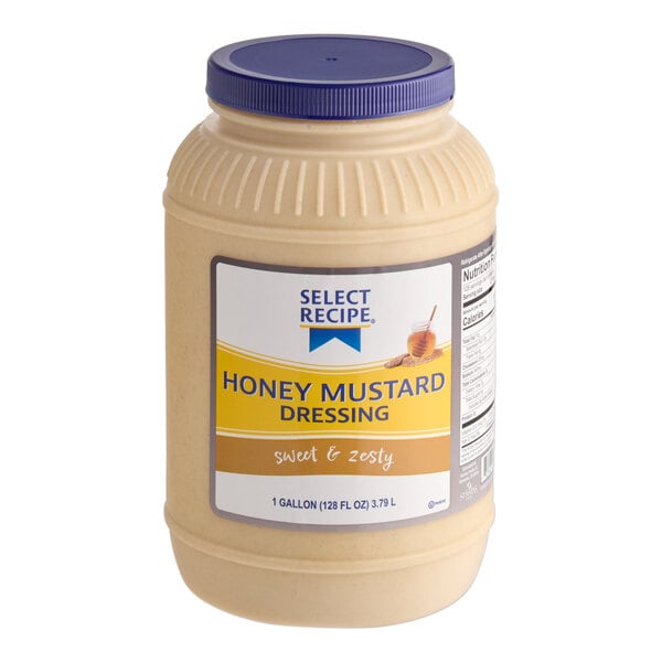 A large plastic jar with a blue lid containing honey mustard dressing, labeled as "Select Recipe Honey Mustard Dressing" and holding 1 gallon (128 fl oz/3.79 L).