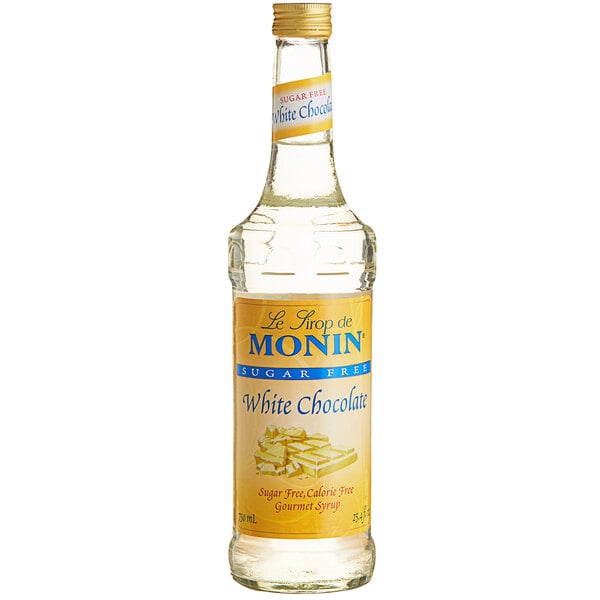 A bottle of Monin Sugar Free White Chocolate Flavoring Syrup on a white background.