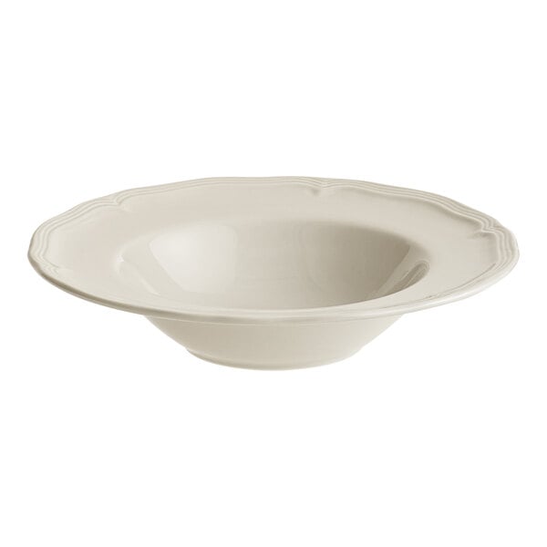 A white bowl with a scalloped edge.