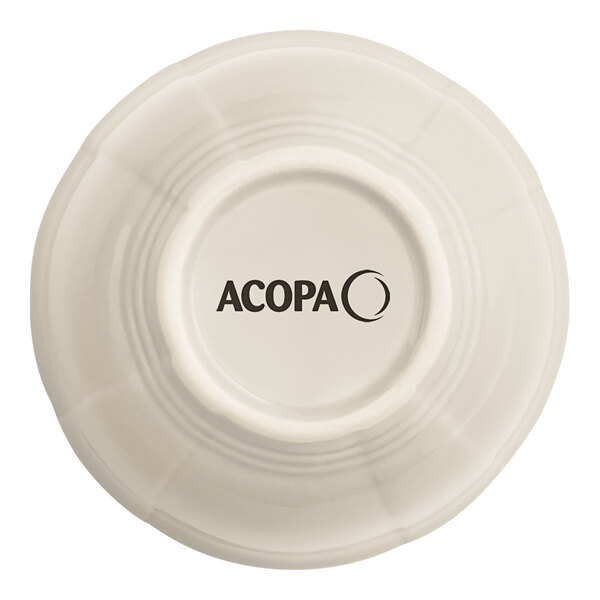 An Acopa Warm Gray porcelain bouillon cup with a scalloped edge and black text.