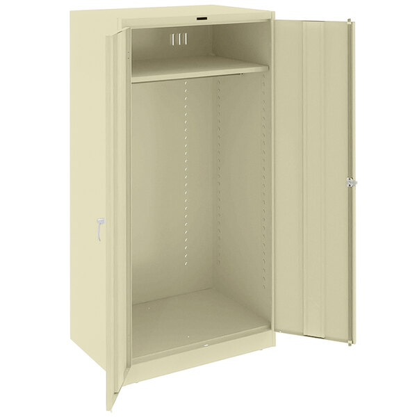 A white metal Tennsco wardrobe cabinet with a door open.