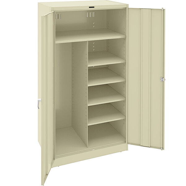A beige Tennsco metal storage cabinet with shelves and solid doors.