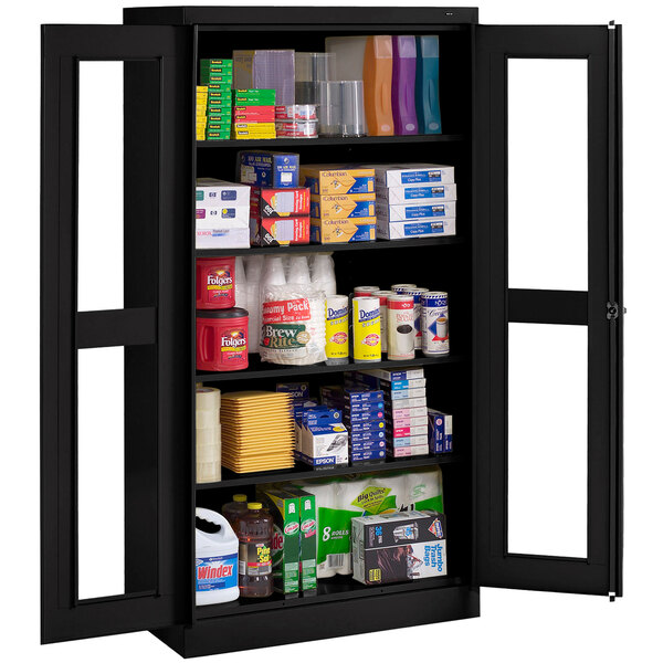 A black Tennsco storage cabinet with C-Thru doors open on a shelf with boxes inside.