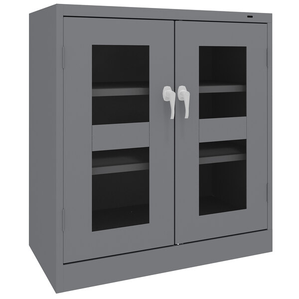 A dark gray Tennsco storage cabinet with C-Thru doors.