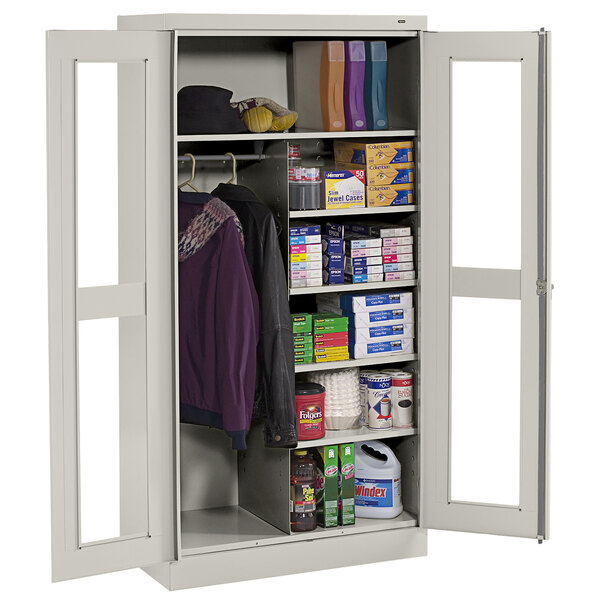 A light gray Tennsco standard combination cabinet with open C-Thru doors filled with items.