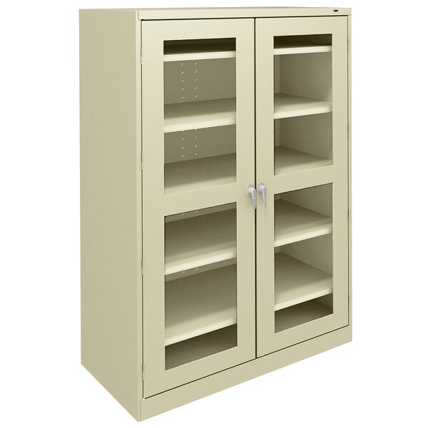 A putty Tennsco storage cabinet with C-Thru doors.