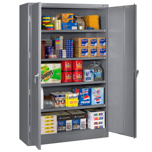 A dark gray Tennsco storage cabinet full of items.