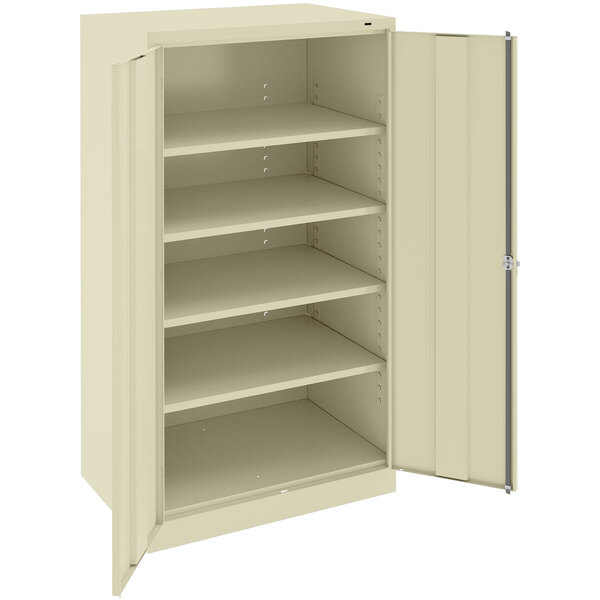 A beige Tennsco storage cabinet with solid doors.