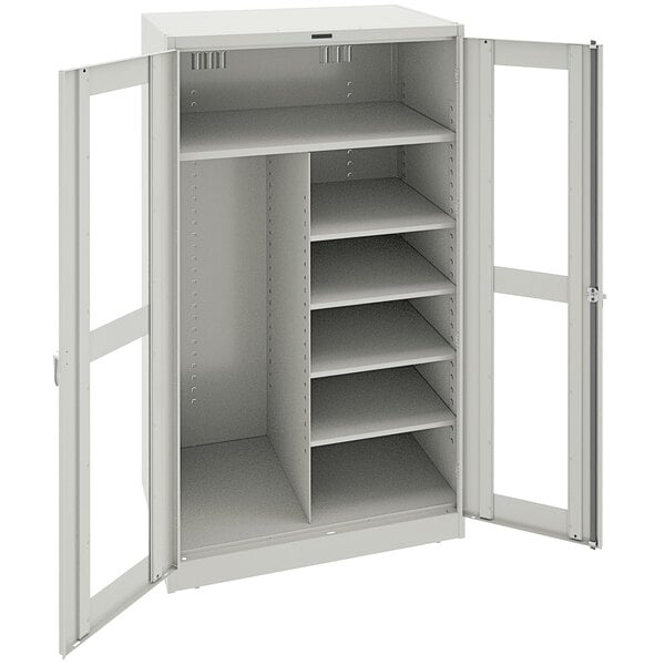 A light gray metal Tennsco combination cabinet with open doors and open shelves.