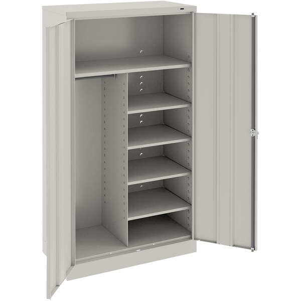 A light gray Tennsco metal storage cabinet with solid doors and shelves.