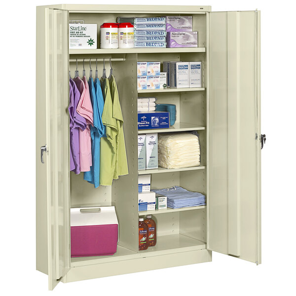 A white Tennsco jumbo combination cabinet with solid doors and items on it.