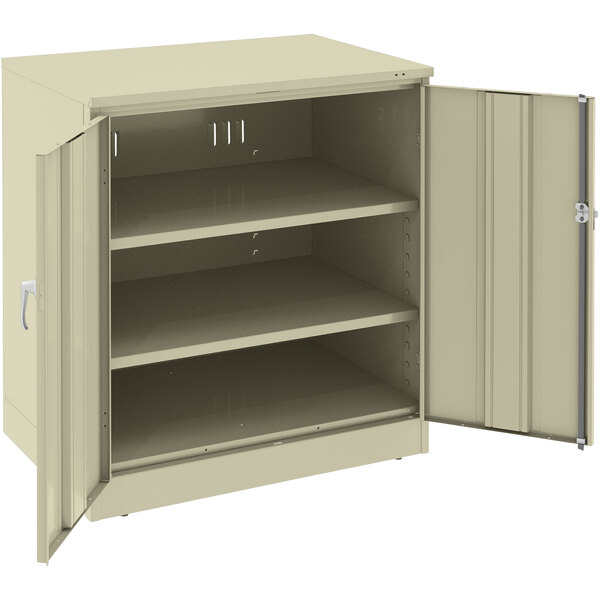 A putty metal Tennsco storage cabinet with open solid doors.