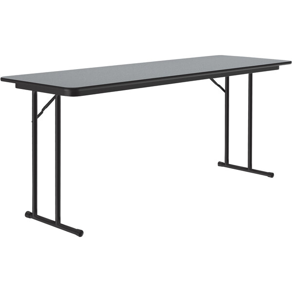 A rectangular Correll seminar table with gray granite top and black legs.