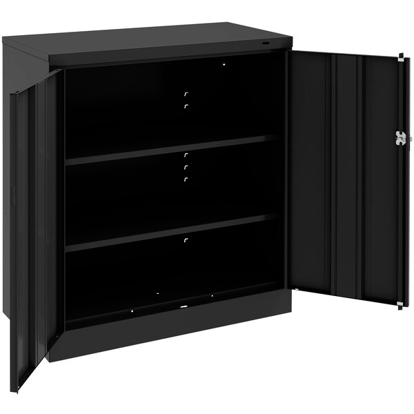 A black metal Tennsco storage cabinet with solid doors open.