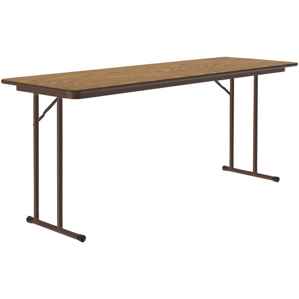 A brown rectangular Correll seminar table with metal legs.