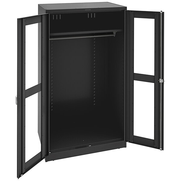 A black metal Tennsco Deluxe wardrobe cabinet with C-Thru doors.