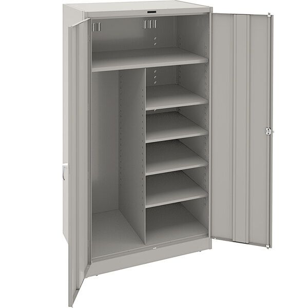 A light gray metal Tennsco combination cabinet with solid doors and shelves.