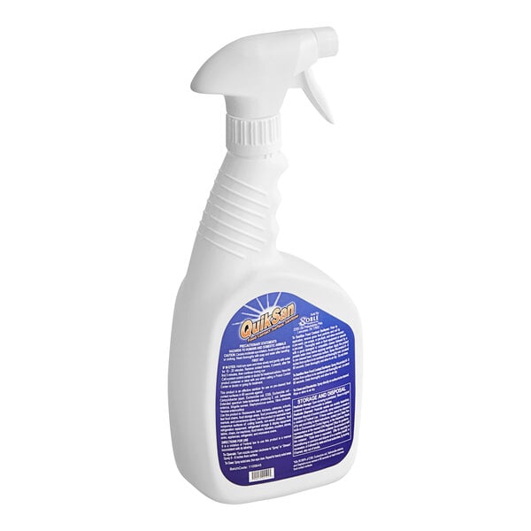 A white bottle with blue label and nozzle containing Noble Chemical QuikSan Surface Sanitizer.