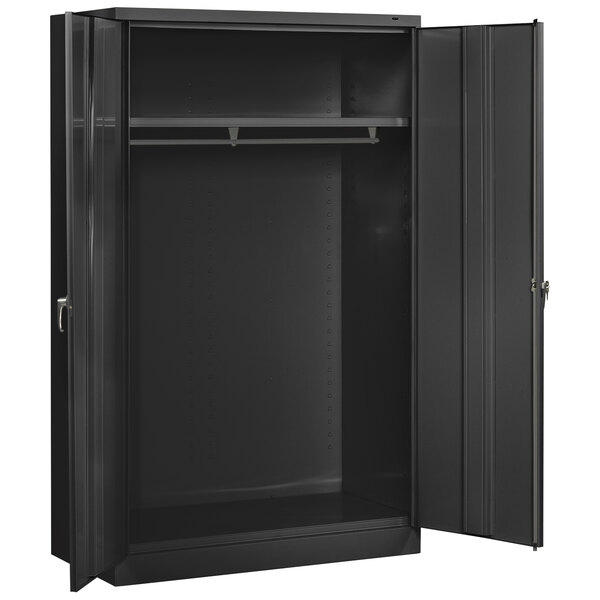 A black metal Tennsco wardrobe cabinet with open doors.