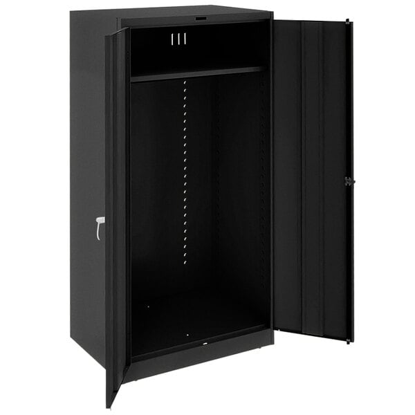 A black Tennsco metal wardrobe cabinet with solid doors open.