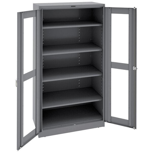 A dark gray metal Tennsco storage cabinet with open doors.