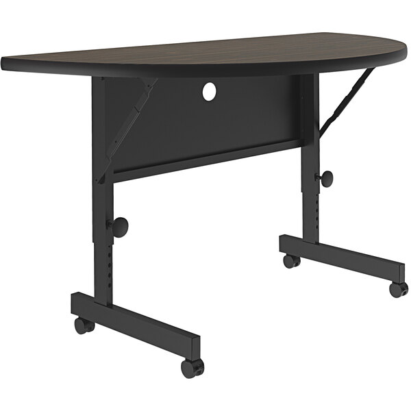 A walnut Correll half round seminar table with wheels.